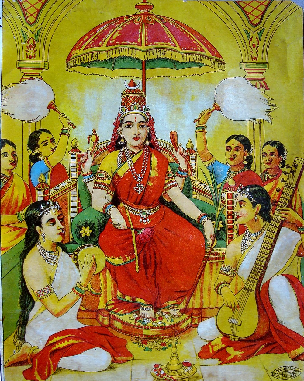 The goddess enthroned in a red sari under a canopy, attendants fanning her, a musician with a veena at her feet — a Ravi Varma Press print titled Ambika.