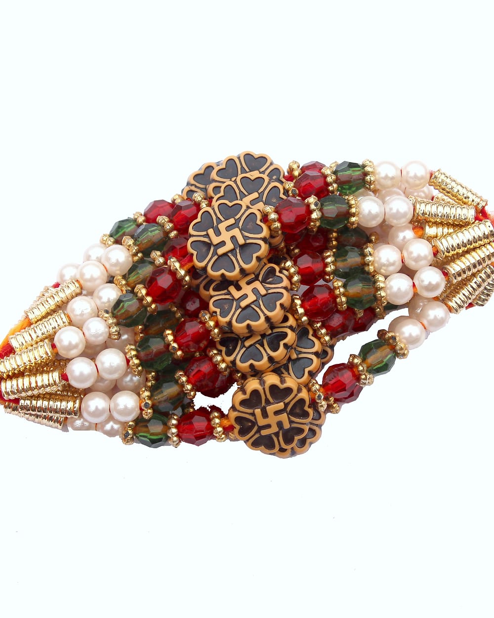 A bundle of rakhi threads strung with beads and pearls, the tassels bright orange.